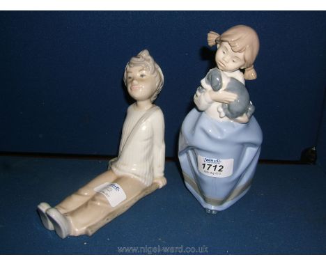 Two Nao by Lladro Figures of a Boy relaxing and a Girl with a puppy