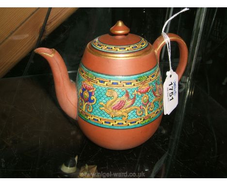 A red clay Teapot with enamel decoration and gilding.