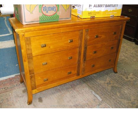 A good quality modern Maple Chest of twin flights of three drawers, with moulded edge rectangular top over the six hardwood l