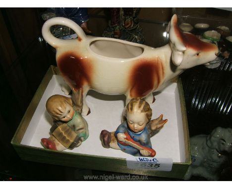 A Goebel Cow Creamer (lid missing), and two small Goebel child musician figures