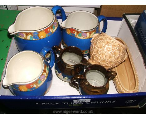 A set of 'Scotch Ivory' Jugs, a Sylvac Trough and Pot and two milk Jugs