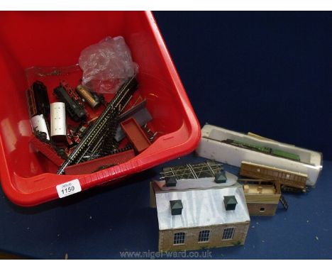 A quantity of Hornby railway items including track, engine shed, carriages and a collector's mounted Flying Scotsman.