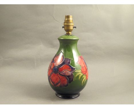 A Moorcroft table lamp base in the anemone pattern, green ground     DTI Failure: Please See Information pages