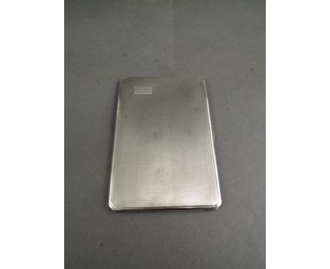 A silver engine-turned cigarette case, Birmingham 1938, 190g
