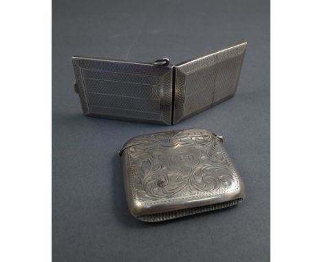 A silver vesta case with engine turned detail, Birmingham 1926, maker's mark W N Ltd and a silver lighter with match striker 