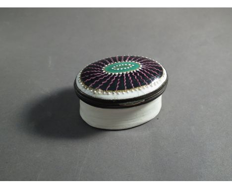 A 19th Century porcelain patch pot with mirrored interior lid, enamelled design to top 