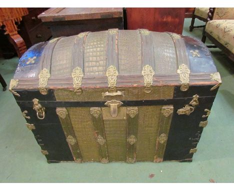 A Victorian dome top travel trunk with brass mounts 