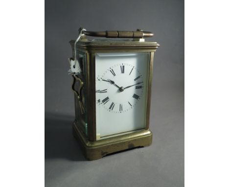 A brass cased carriage clock and key 