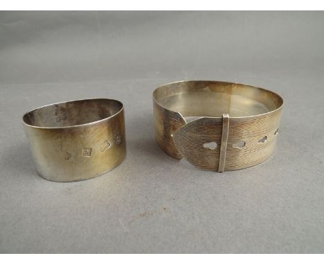 A Charles Horner silver bangle, Chester 1944 (a/f) and a silver napkin ring, Birmingham, 56g (2)