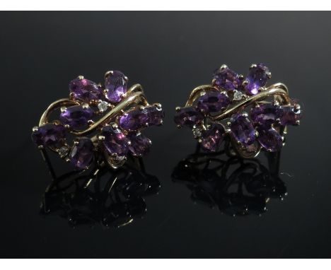 A pair of amethyst and diamond earrings 