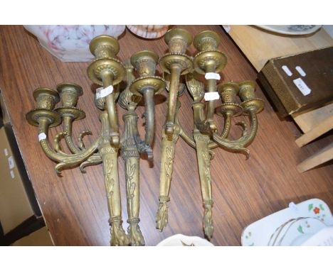 FOUR CLASSICALLY STYLED METAL DOUBLE LIGHT WALL SCONCES