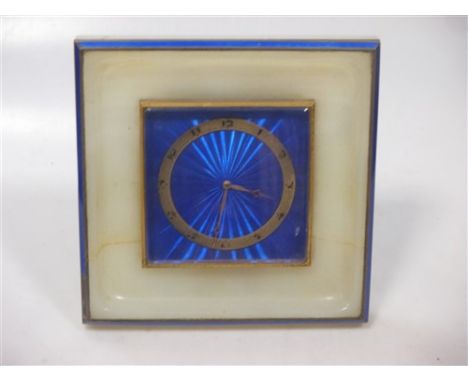 An Art Deco alabaster and blue enamel timepiece