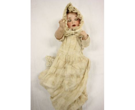 Armand Marseille Bisque Headed Doll impressed mark to neck ' Germany, 970, A 3 M ' wearing early 20th century Bonnet and Gown