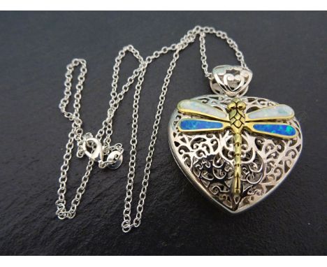 A fine silver and opal heart shaped locket 