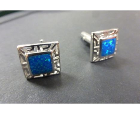 A pair of silver Marcasite and blue opal cufflinks 