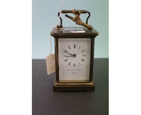 Gilt Brass Carriage Clock, the white enamel face marked Matthew Norman, London