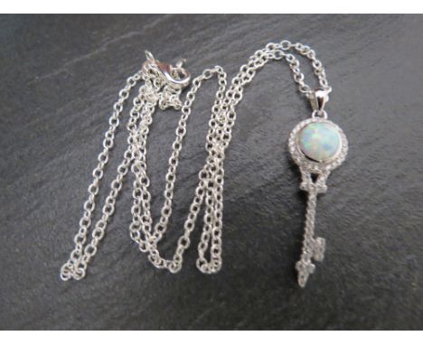 A silver and CZ pendant necklace with opal panel on silver chain 