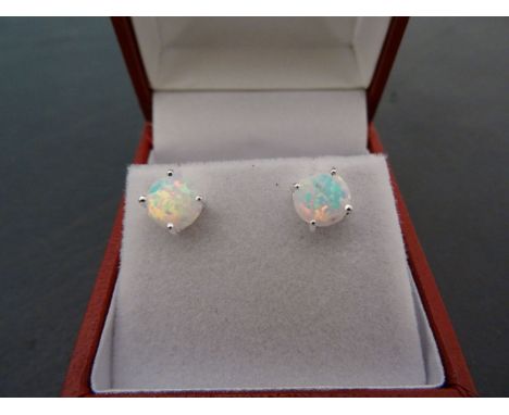 A pair of cased opal earrings