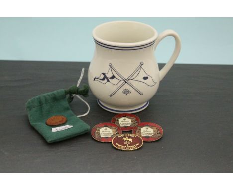 Mulberry mug containing four enamel Mulberry St Petersburg Challenge 1994 badges