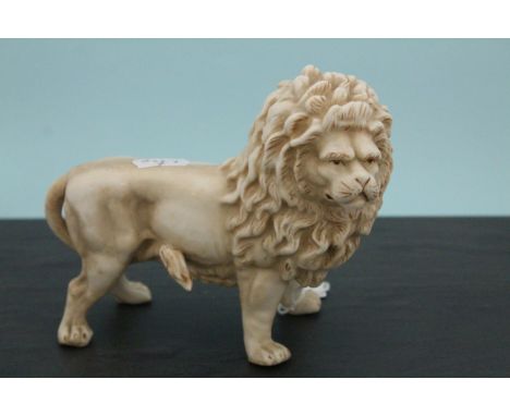 A continental ceramic lion figure numbered to base