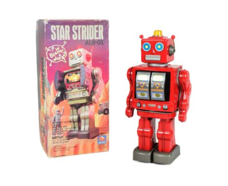 Tinplate Toys - a vintage Japanese Tin Toy Project Star Strider AIJI-01 battery operated robot, colour red. In excellent cond