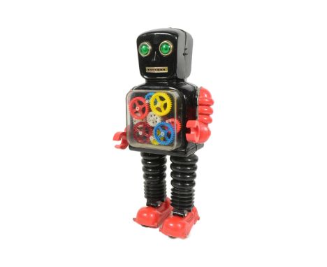 Tinplate Toys - a vintage Japanese Taiyo Blink-A-Gear robot, featuring a tinplate body, plastic arms and legs, and see-throug