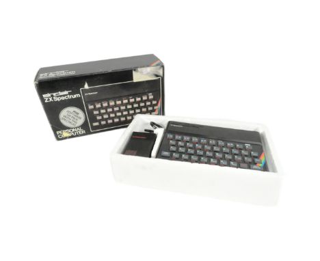 Retro Gaming - a vintage 1980s Sinclair ZX Spectrum 48K personal computer console with Horizons software starter pack, instru