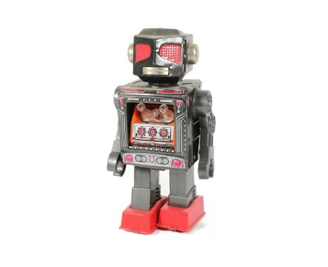 Tinplate Toys - a vintage Japanese Horikawa 'Attacking Martian' robot, featuring chest cavity with shooting guns, and walking