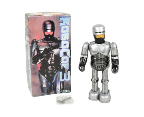 Tinplate Toys - a Japanese Billiken Robocop 3 mechanical robot. Featuring moving arms and legs, with key present. Tested and 