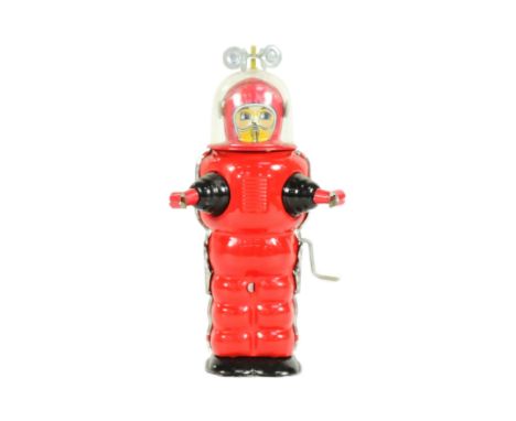 Tinplate Toys - a vintage Japanese Tin Tom Toy wind-up Moon Explorer astronaut robot. Featuring rotating antenna and rolling 
