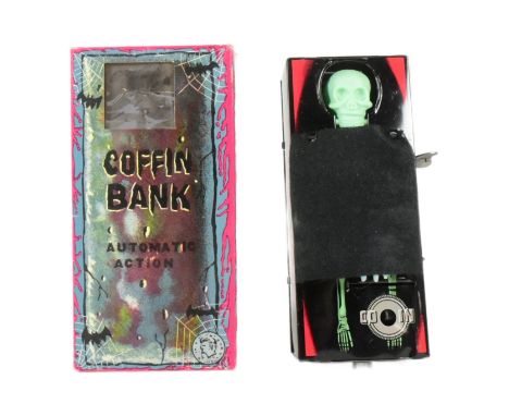 Tinplate Toys - a vintage Japanese wind-up, automatic action, coffin bank. Tested and is in working order, complete with orig