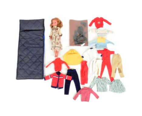 Sindy - a vintage 1970s Pedigree Sindy Doll 033055X with brown hair and a selection of clothing to include red horse riding o
