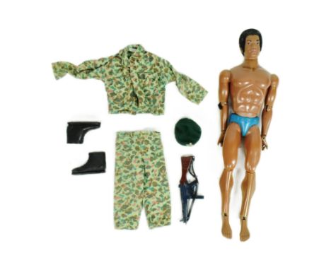 Action Man - a vintage 1970s Palitoy / Hasbro made Action Man figure Tom Stone. Flock haired example with fixed eyes, camo un