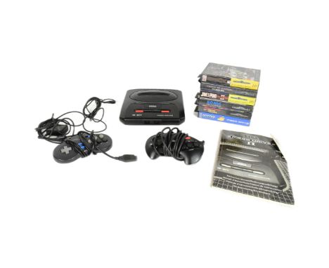 Retro Gaming - a vintage 1990s (1993) Sega Megadrive II video game console with x6 original cartidge games comprising; Sonic 