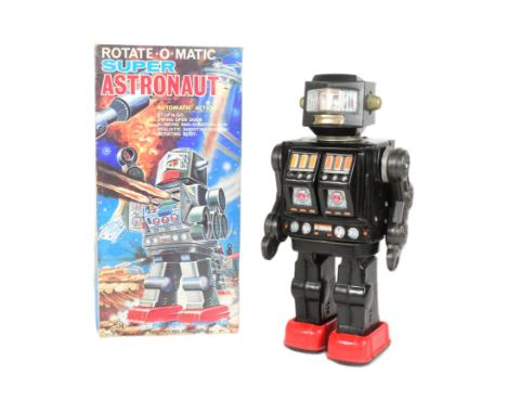 Tinplate Toys - a vintage Japanese Horikawa Rotate-O-Matic Super Astronaut. Featuring stop'n go action, swinging open doors, 