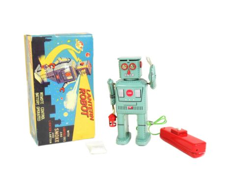 Tinplate Toys - a vintage 2005 Ha Ha Toy Co. Lantern Robot with lighted eyes, lantern and smoke. Remote control battery opera