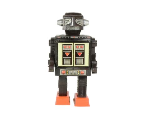 Tinplate Toys - a vintage Japanese Horikawa 'Space Fighter' robot. Featuring stop'n go action, an opening chest cavity to rev