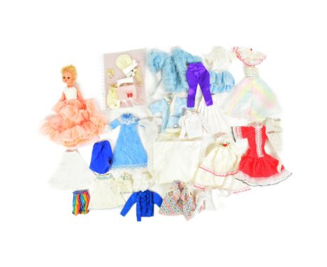Sindy - an original vintage Pedigree made Sindy doll 033055X with blonde hair and associated clothing to include gowns and dr