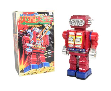 Tinplate Toys - a vintage Japanese SH battery controlled walking robot. Featuring revolving torso, walking arms and legs, an 