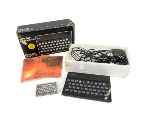 Retro Gaming - a vintage 1980s Sinclair ZX Spectrum 48K personal computer console with Horizons software starter pack, instru