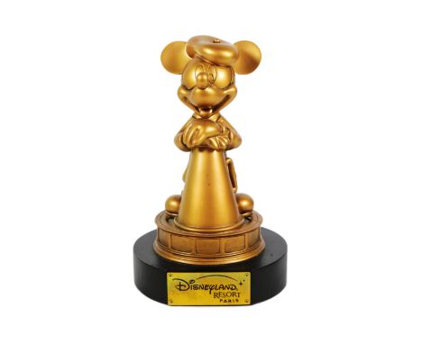 Mickey Mouse - an original Disneyland Paris Resort Mickey Mouse gold painted figure in gold leaning on a vintage-style megaph