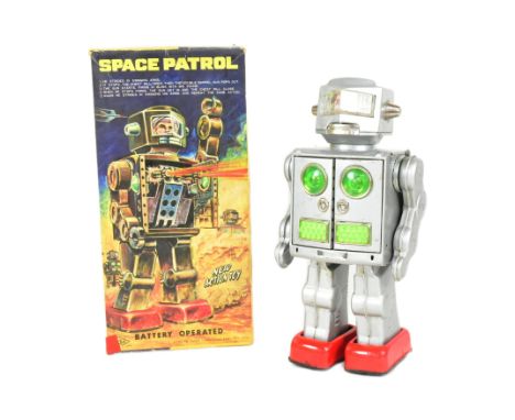 Tinplate Toys - a vintage Japanese SH Horikawa Space Patrol robot. Featuring swinging arms, opening chest, firing guns and wa