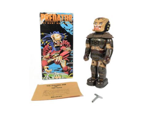 Tinplate Toys - a 1995 Japanese Billiken Predator robot. Featuring walking action and swinging hands. Tested and is in workin