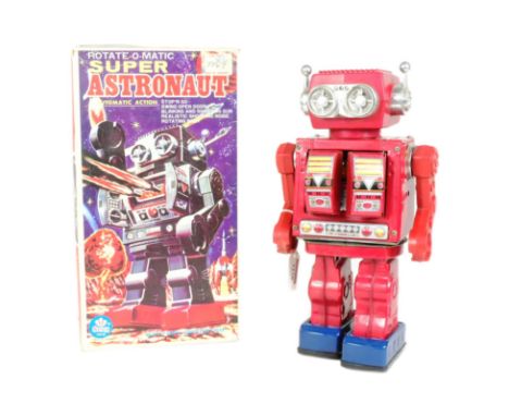 Tinplate Toys - a vintage Taiwanese Sunny Toys Rotate-O-Matic Super Astronaut. Featuring stop'n go action, swing open door, b