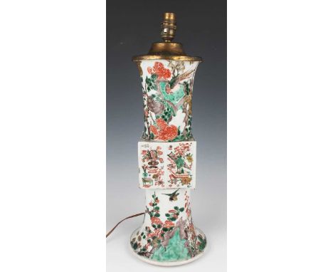 A Chinese famille verte archaistic gu-form porcelain vase, Kangxi period, the panelled square mid-section painted with precio