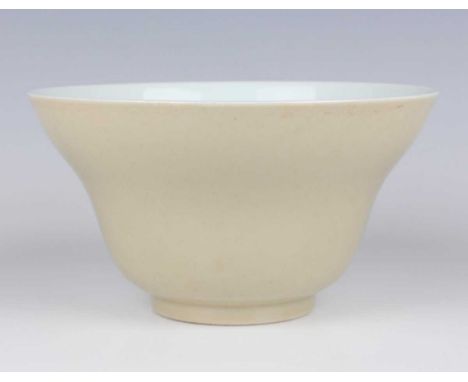 A Chinese pale café-au-lait glazed porcelain ogee form bowl, mark of Daoguang but later, of steep-sided circular form with fl