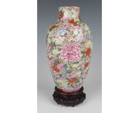 A Chinese famille rose enamelled millefleurs porcelain vase, mark of Qianlong but Republic period, of shouldered ovoid form, 