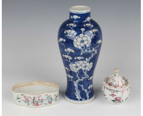 A Chinese blue and white porcelain vase, late 19th/early 20th century, of slender baluster form, painted with blossoming prun