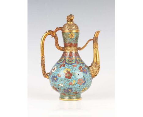 A Chinese cloisonné enamel and gilt copper ewer, mark and period of Qianlong, the pear-form body decorated with blue, red, ye