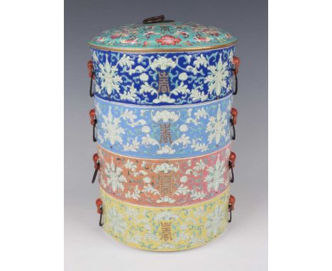 A Chinese famille rose enamelled porcelain four-tier stacking box and cover, late Qing dynasty, of cylindrical form with slig